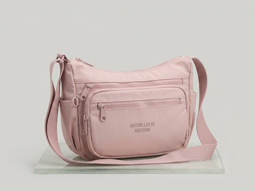 Sac bandoulière multi-poches demi-lune